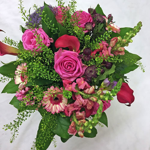 Fleurs-amanda-Surrey-funeral-flowers Red Double Ended Spray pink Roses